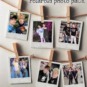 May include: A set of six Polaroid photos featuring two men, likely friends or bandmates, in various poses and locations. The photos are hung on a string with clothespins, creating a casual and fun display.