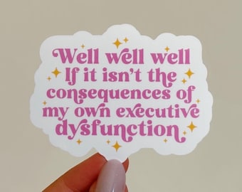 May include: White sticker with a pink cloud shape and gold stars. The text on the sticker reads "Well well well If it isn't the consequences of my own executive dysfunction."