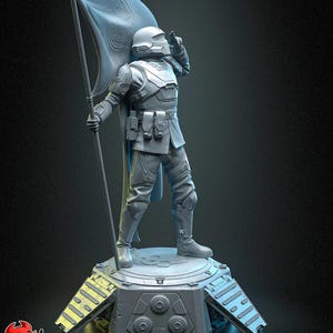 以下が含まれることがあります： 旗にシンボルが描かれた旗を持った兵士のグレーの3Dプリントフィギュア。兵士はヘルメットとアーマーを着用しています。フィギュアは、タンクの履帯のデザインが施されたベースを持つプラットフォームの上に立っています。