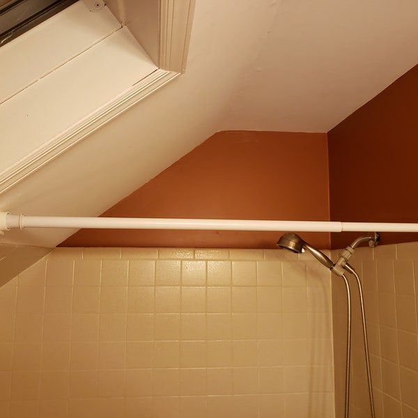 Sloped ceiling curtain rod mount