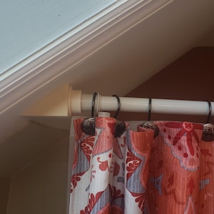 Sloped ceiling curtain rod mount