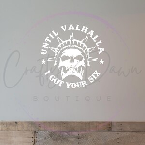 May include: White vinyl decal with a skull wearing a crown and the text "Until Valhalla I got your six".