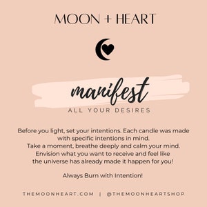 May include: A pink background with a black crescent moon and heart graphic. The text "MOON + HEART" is at the top of the image. The text "manifest" is in a large, stylized font. The text "ALL YOUR DESIRES" is below the word "manifest". The text "Before you light, set your intentions. Each candle was made with specific intentions in mind. Take a moment, breathe deeply and calm your mind. Envision what you want to receive and feel like the universe has already made it happen for you! Always Burn with Intention!" is below the text "ALL YOUR DESIRES". The text "THEMOONHEART.COM | @THEMOONHEARTSHOP" is at the bottom of the image.