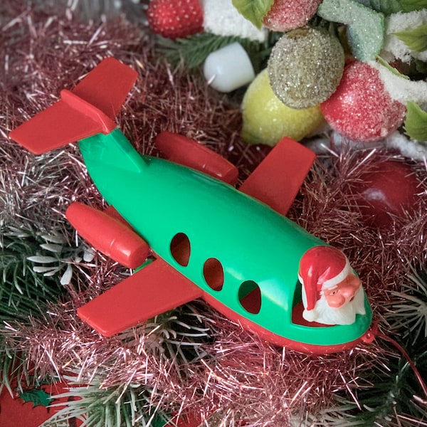 Vintage Santa airplane pull toy Christmas decoration small Hong Kong plastic Santa plane