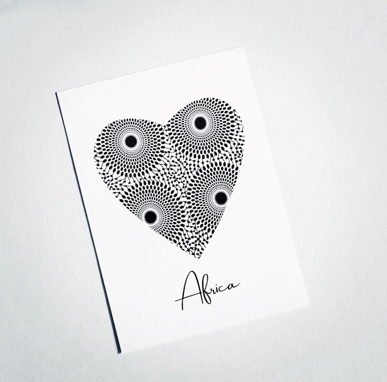 May include: A black and white heart-shaped design with a geometric pattern. The word "Africa" is written below the design.