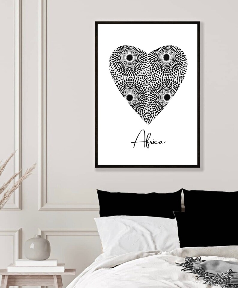 May include: Black and white print of a heart with a geometric pattern inside. The word "Africa" is written below the heart.