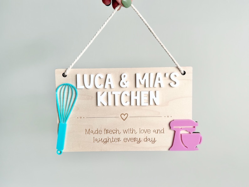 Wooden personalized play kitchen sign with whisk and mixer.