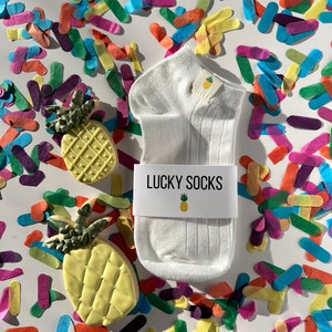 lucky ivf socks have become a symbol of hope + resilience for women on their fertility journey. Socks are the only item of clothing that you are allowed to keep on during an ivf egg retrieval + embryo transfer so make  them lucky pineapple socks!