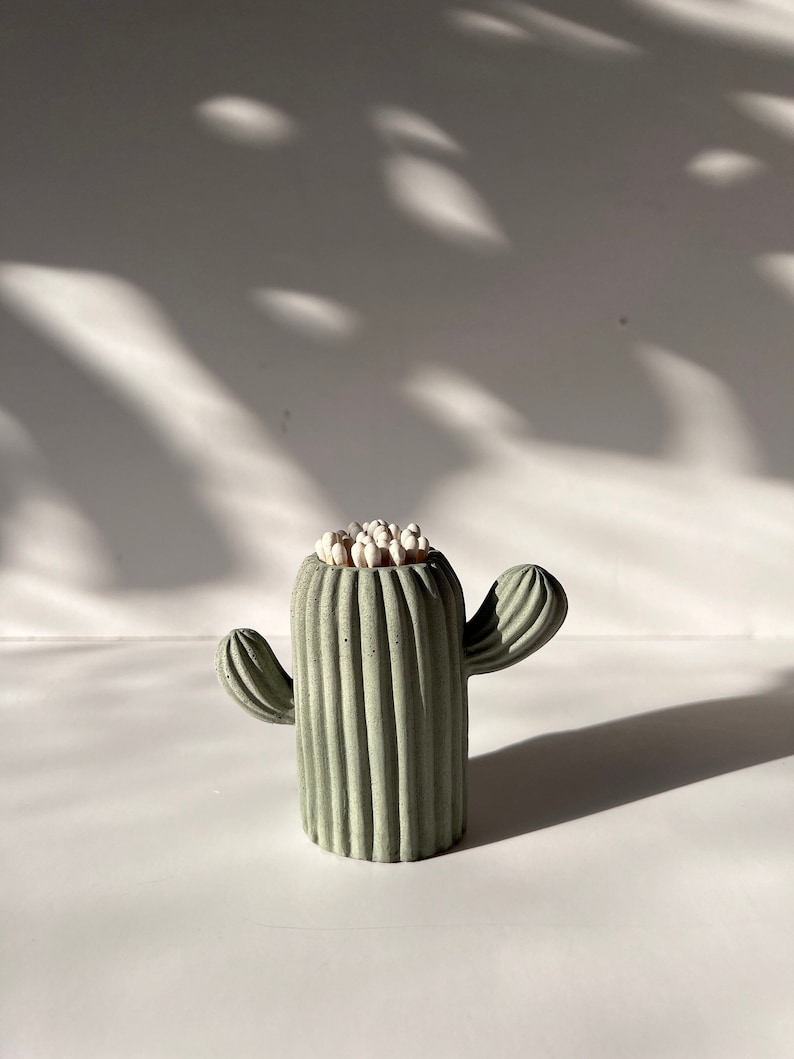 Add a touch of desert charm to your home with our mini cactus match holder. Handcrafted with love, this cute match holder features a striker  on the bottom for easy lighting.
