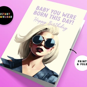 May include: A printable birthday card featuring a portrait of a woman with blonde hair wearing sunglasses. The text on the card reads "Baby you were born this day! Happy Birthday."