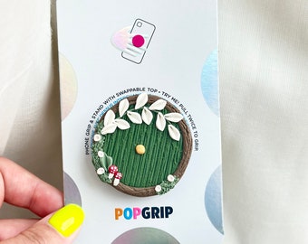 Handgemaakte telefoongreep met Hobbit-gaatje: op Tolkien geïnspireerde PopSocket