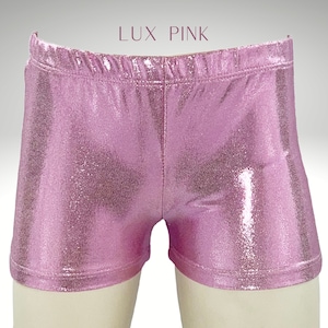 May include: Pink metallic shorts with a shiny finish.  LUX PINK is written in white text at the top of the image.