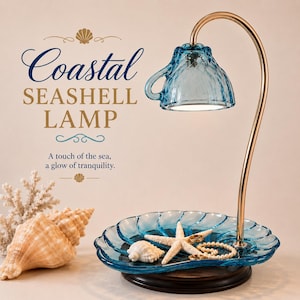 May include: A blue glass lamp featuring a teacup-shaped shade and a seashell-shaped base. The lamp has a gold-toned curved arm and sits on a dark wooden stand. Text on the image reads: Coastal SEASHELL LAMP A touch of the sea, a glow of tranquility.