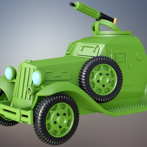 May include: A green toy armoured car with a machine gun on top. The car has four wheels and a detailed design.