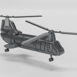 May include: A gray model of a military helicopter with two sets of rotating blades. The helicopter has a large, rectangular body with a rounded nose and a small tail.
