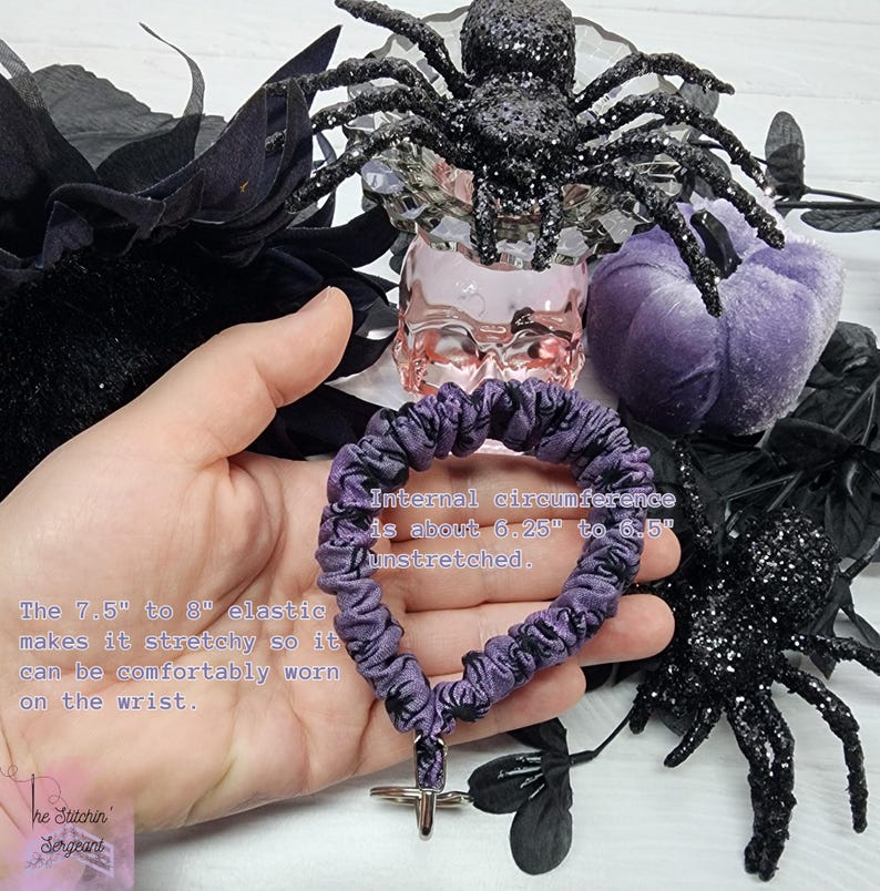 There is a description on the image of the size of the keychain. Internal circumference is about 6.25 inch to 6.5 inch unstretched. The 7.5 inch to 8 inch elastic makes it stretchy so it can be comfortably worn on the wrist.