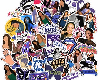 May include: A collection of assorted vinyl stickers featuring various illustrations, photographs, and text related to Olivia Rodrigo, including references to the albums SOUR and GUTS, butterflies, song titles, and concert tour imagery in purple and blue.