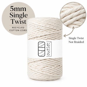 May include: A spool of 5mm single twist recycled cotton cord in an off-white color. The spool features a white paper label with the text outlet and a graphic icon. Text on the image reads 5mm Single Twist Recycled Cotton Cord and Single Twist Not Braided.