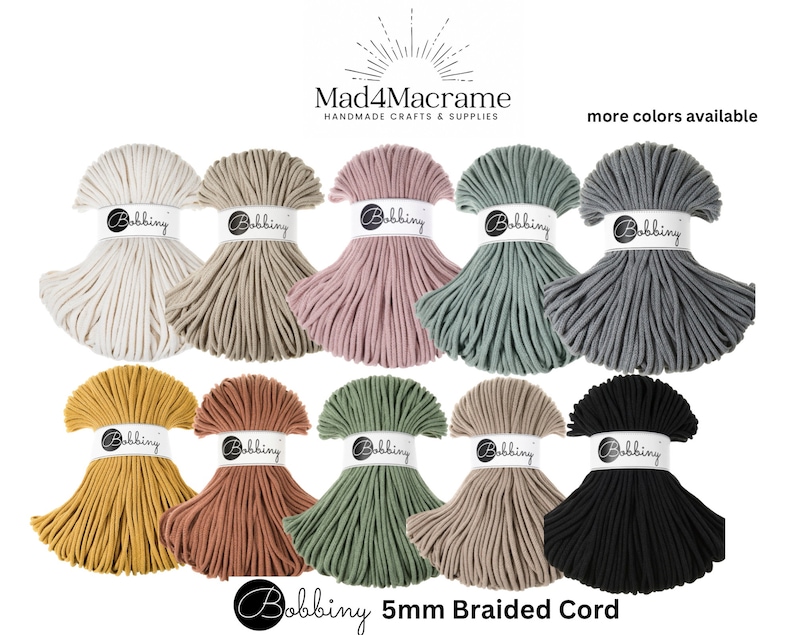 May include: Assortment of 10 spools of 5mm braided cord in various colors, including white, beige, pink, green, gray, yellow, orange, sage, tan, and black. The cord is labeled "Bobbiny 5mm Braided Cord".