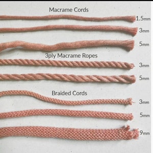 May include: A close-up of six different types of macrame cords and ropes in a light brown color. The cords are arranged in rows, with the thicker cords at the bottom. The cords are labeled with their thickness in millimeters: 1.5mm, 3mm, 5mm, 3mm, 5mm, 9mm. The cords are labeled as "Macrame Cords", "3ply Macrame Ropes", and "Braided Cords".