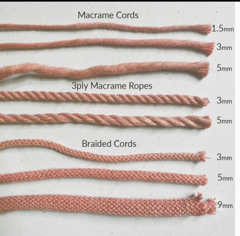 May include: A close-up of six different types of macrame cords and ropes in a light brown color. The cords are arranged in rows, with the thicker cords at the bottom. The cords are labeled with their thickness in millimeters: 1.5mm, 3mm, 5mm, 3mm, 5mm, 9mm. The cords are labeled as "Macrame Cords", "3ply Macrame Ropes", and "Braided Cords".