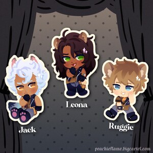 May include: Three cartoon character stickers with light yellow outlines. The characters are a wolf with white fur and blue eyes, a lion with brown fur and green eyes, and a hyena with brown fur and blue eyes. The stickers are on a gray background with white polka dots. The text 'Jack', 'Leona', and 'Ruggie' are below each sticker.