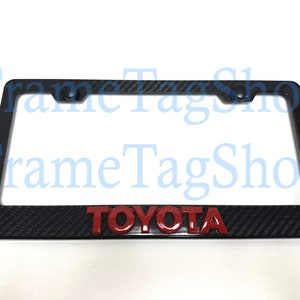 1x Red Toyota 3D Emblem Badge Real 3K TwillWeave Real Carbon Fiber License Plate Frame