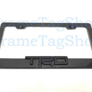 1x Black TRD 3D Emblem Badge Real 3K TwillWeave Real Carbon Fiber License Plate Frame