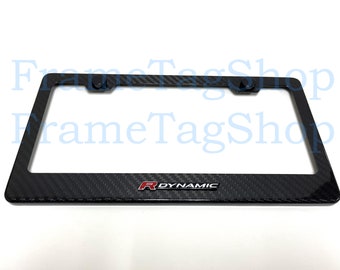 May include: Black carbon fiber license plate frame with a red "R Dynamic" logo.