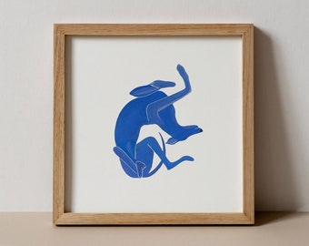 May include: A framed illustration of a blue dog curled up in a ball. The dog is outlined in white and the background is white.