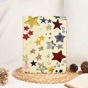 May include: A handmade wooden sign with the text "Welcome" in a playful font. The sign is painted white with a distressed finish, and features a decorative floral design in shades of pink and green. It measures approximately 12 inches wide.