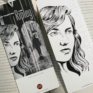 May include: Two rectangular paper bookmarks with white tassels. The left bookmark features a black and white illustration of a person and a silhouette in an alleyway with the text The Talented Mr. Ripley. The right bookmark shows a portrait with the text Patricia Highsmith.