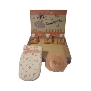 May include: Vintage "Little Miss Pixie" perfume set. The set includes three small perfume bottles, a powder puff, and a floral-patterned mitt. The box features a cartoon girl illustration and the text "Toiletries for the young Miss!"