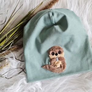 Handmade beanie hat with cuddly otter - in many colors & sizes - personalizable with name