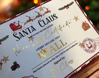 May include: A rectangular certificate titled Santa Claus Nice List Certificate with gold foil lettering. It features a reindeer sleigh graphic, a North Pole Airmail stamp, a gingerbread house, and the name Niall. It is signed by S. Claus.