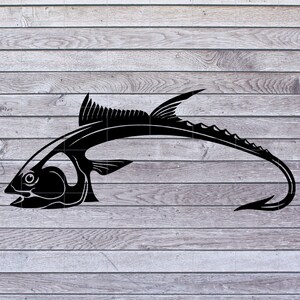 May include: Black silhouette of a fish with a long, curved tail. The fish is facing left and has a detailed design.
