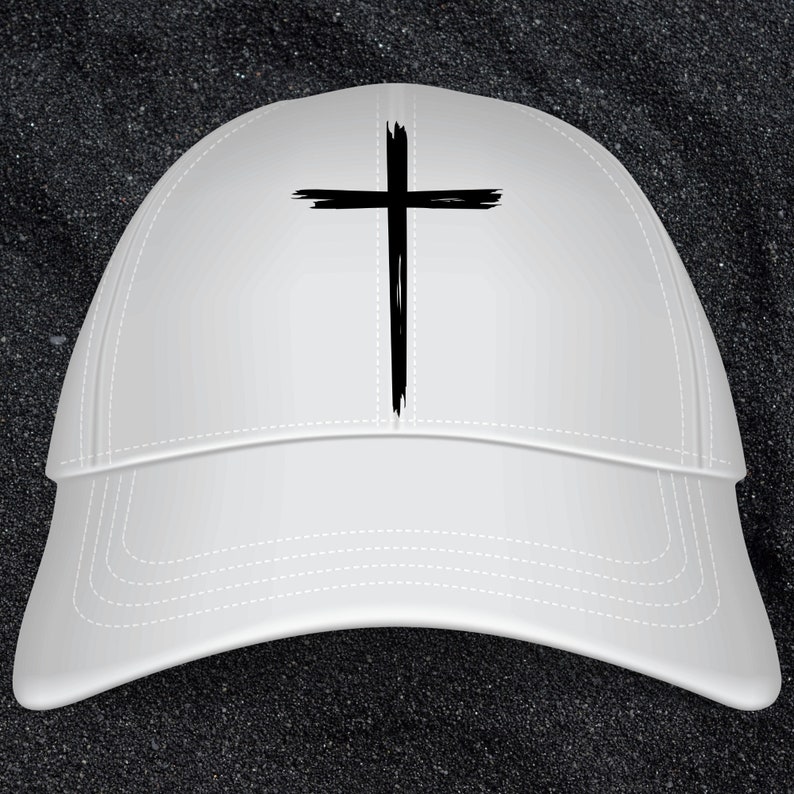 May include: A white baseball cap with a black cross design on the front.