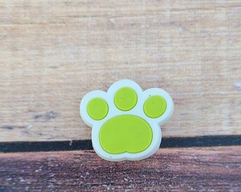 White and light green pawprint shoe charms