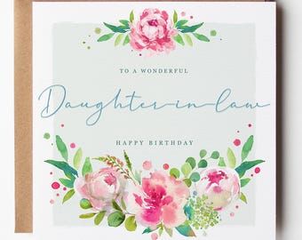 May include: A square greeting card with a light gray background, featuring watercolor pink peonies and green leaves at the top and bottom. The text reads TO A WONDERFUL Daughter-in-law HAPPY BIRTHDAY in blue and black script and block fonts.