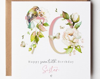 May include: A square greeting card featuring the number 70 in a soft pink gradient, decorated with watercolor illustrations of a small bird, white flowers, green leaves, and butterflies. The text reads Happy seventeenth Birthday Sister.