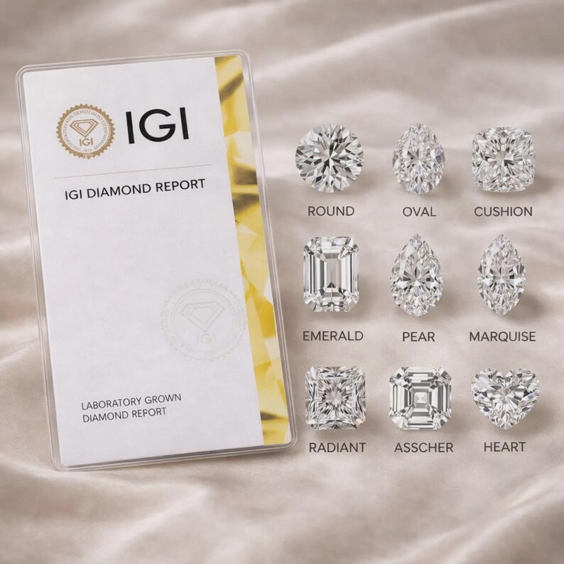 May include: An IGI Diamond Report card next to nine loose diamonds in various cuts: round, oval, cushion, emerald, pear, marquise, radiant, asscher, and heart. The report features the IGI logo and the text Laboratory Grown Diamond Report.