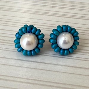 One of a kind beaded round stud earrings. Blue white beads.