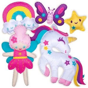 May include: A collection of colorful felt craft items including a rainbow, clouds, a butterfly, a star, a fairy, and a unicorn. The fairy has pink hair and a pink dress. The unicorn is white with a yellow horn and colorful stars.