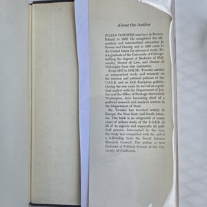 May include: An open book with a black cover and a white page with text. The text, titled "About the Author," details the life and career of Julian Towster, including his education, travels, and research on the U.S.S.R.