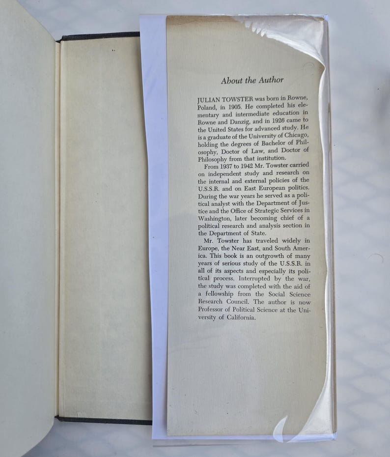 May include: An open book with a black cover and a white page with text. The text, titled "About the Author," details the life and career of Julian Towster, including his education, travels, and research on the U.S.S.R.