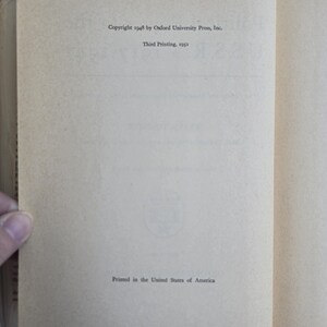 May include: Open book pages with text. The left page shows the copyright information from 1948 by Oxford University Press, Inc. and the third printing in 1951. The right page is blank. The bottom of the left page reads "Printed in the United States of America."