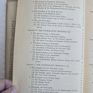 May include: Open book page with a table of contents. The text includes chapter titles such as "The Class Principle" and "The Nationality Principle." The page is yellowed with age.