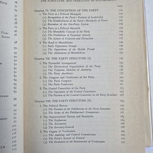 May include: Open book page with a detailed table of contents. The text is black on a cream-colored page, listing chapters and sub-sections about political structures and party organization. The page numbers are visible.