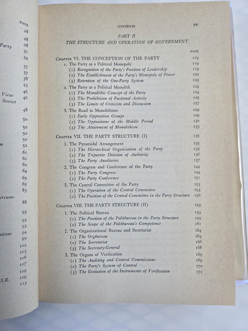 May include: Open book page with a detailed table of contents. The text is black on a cream-colored page, listing chapters and sub-sections about political structures and party organization. The page numbers are visible.