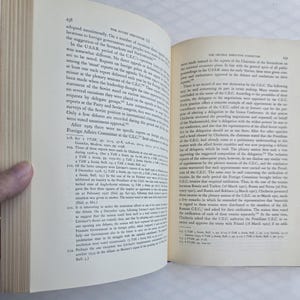 May include: Open book with text on the pages. The left page has the number 238 at the top. The text is in English and discusses the Soviet structure and foreign policy.